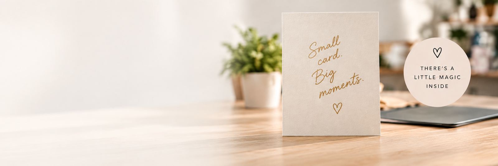 A Moment card on a table that reads Small card. Big moments.